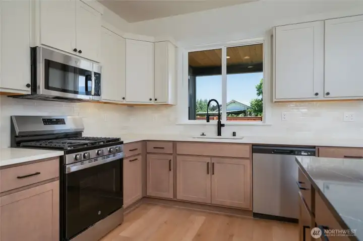 Kitchen -  Pics are of a different 2601 Hattie plan home. Features and colors may differ.