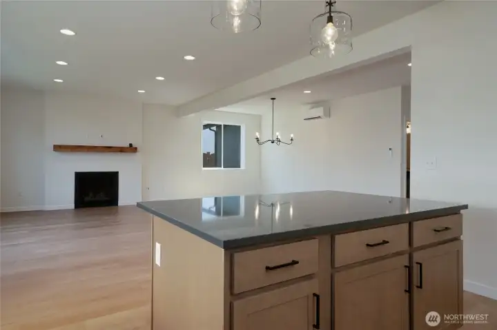 Kitchen that open to living room and dining room -  Pics are of a different 2601 Hattie plan home. Features and colors may differ.