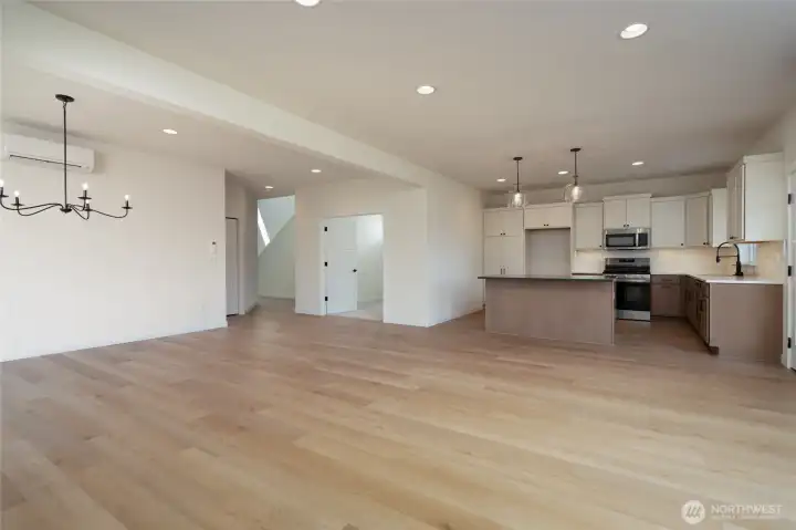 Open kitchen and great room that adjoins office/flex room.  Pics are of a different 2601 Hattie plan home. Features and colors may differ.