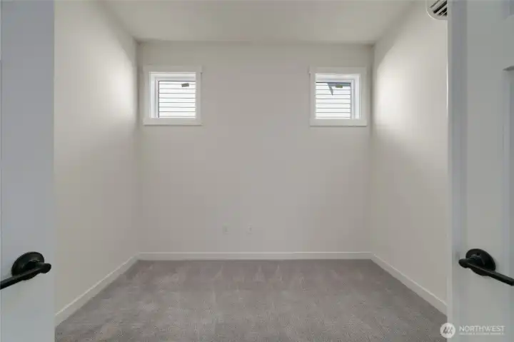 Main level office/flex space with double doors.  Pics are of a different 2601 Hattie plan home. Features and colors may differ.