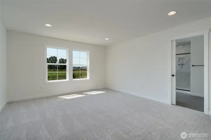 Upstairs primary bedroom -  Pics are of a different 2601 Hattie plan home. Features and colors may differ.