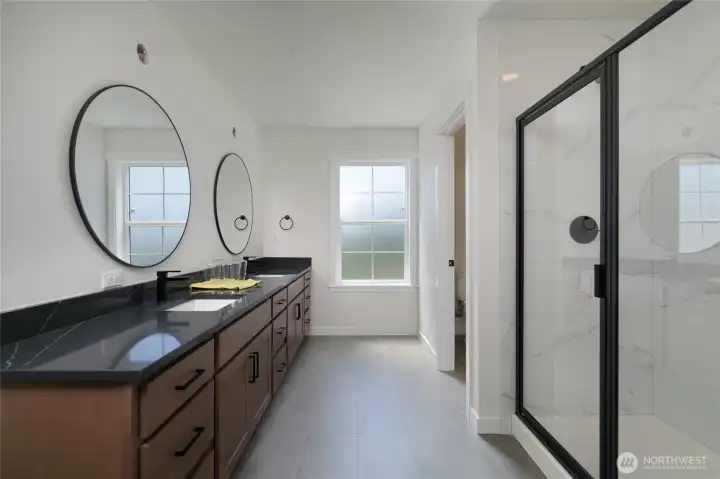 Primary bathroom with tile shower, tile floor & double sinks -  Pics are of a different 2601 Hattie plan home. Features and colors may differ.