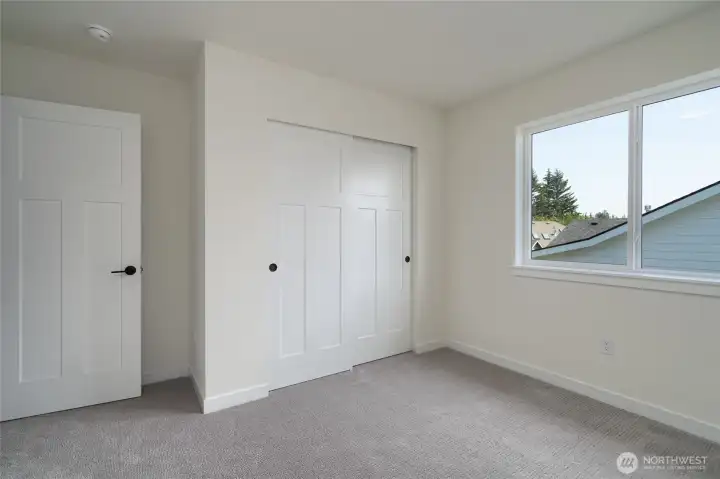 Second upstairs bedroom -  Pics are of a different 2601 Hattie plan home. Features and colors may differ.