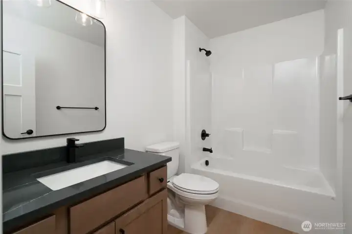 Upstairs full guest bathroom -  Pics are of a different 2601 Hattie plan home. Features and colors may differ.