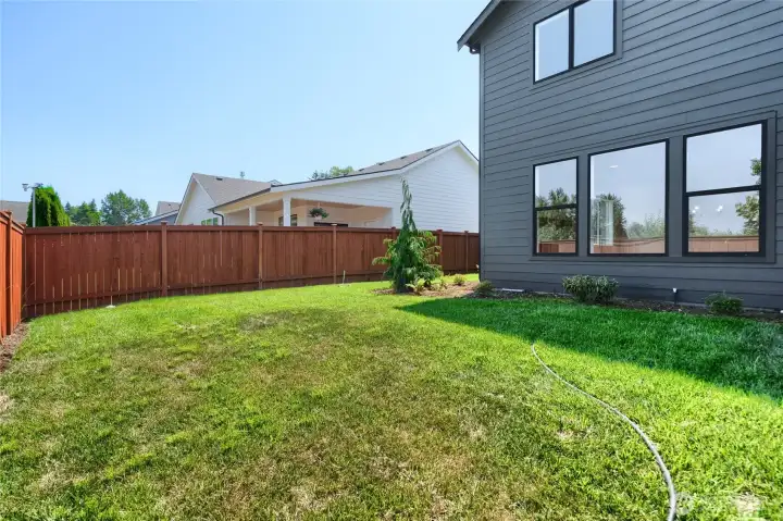 Fenced backyard with gate -  Pics are of a different 2601 Hattie plan home. Features and colors may differ.