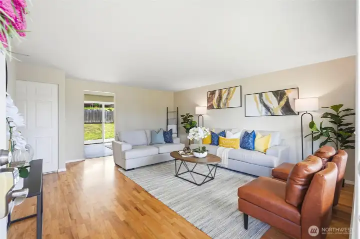 Bright and welcoming living room filled with natural light. Beautiful hardwood floors add warmth and character. Bright and welcoming living room filled with natural light. Beautiful hardwood floors add warmth and character.