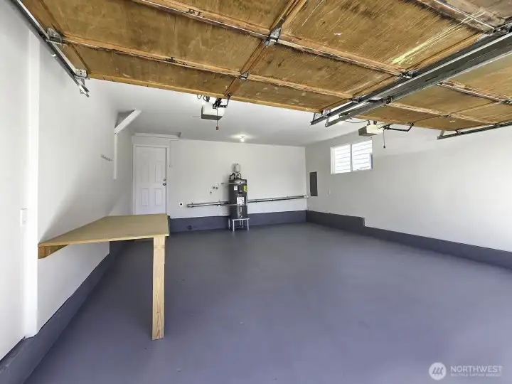 Notice the fold-out table for instant workspace. Ideal for parking, storage, hobbies, or a workshop. Great home gym potential. A garage you'll actually want to spend time in. Notice the fold-out table for instant workspace. Ideal for parking, storage, hobbies, or a workshop. Great home gym potential. A garage you'll actually want to spend time in.