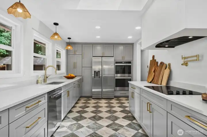 Spacious updated kitchen with plenty of storage space and light.
