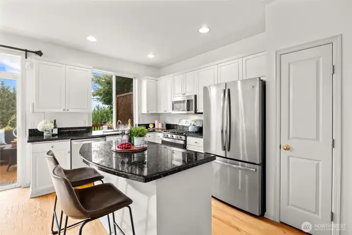 Kitchen with granite counters and white cabinets, ss appliances and island Kitchen with granite counters and white cabinets, ss appliances and island