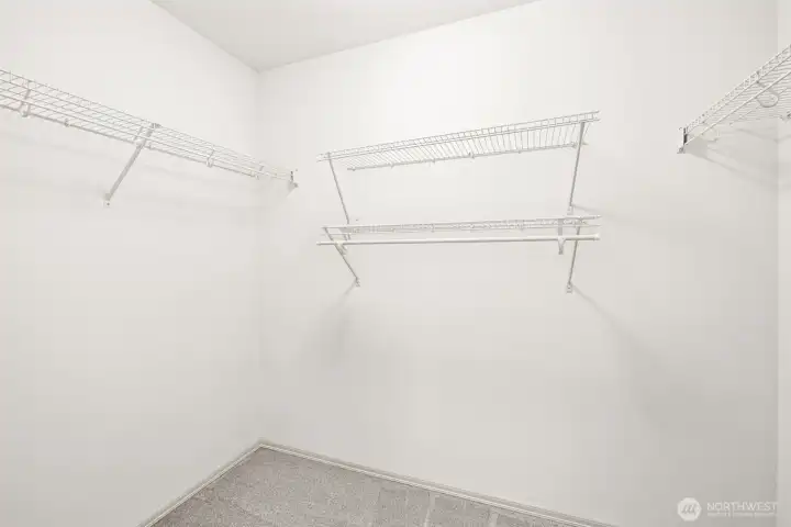 Primary walk-in closet Primary walk-in closet