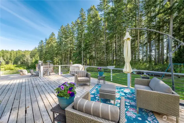 Expansive deck space for relaxing and enjoying the hot tub