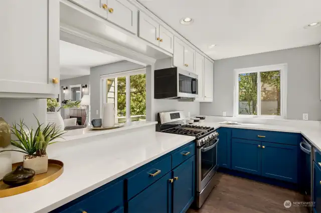 Gorgeous kitchen with new quartz countertops and brand new dishwasher.