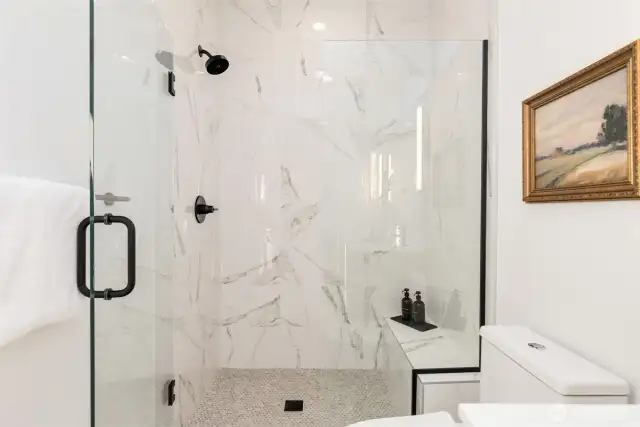 Primary suite shower.  Photos are staged model of same floorplan.  Color schemes may vary.