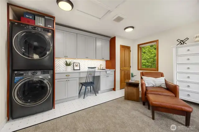 The laundry area has been recently updated with new cabinets, counters and back splash.