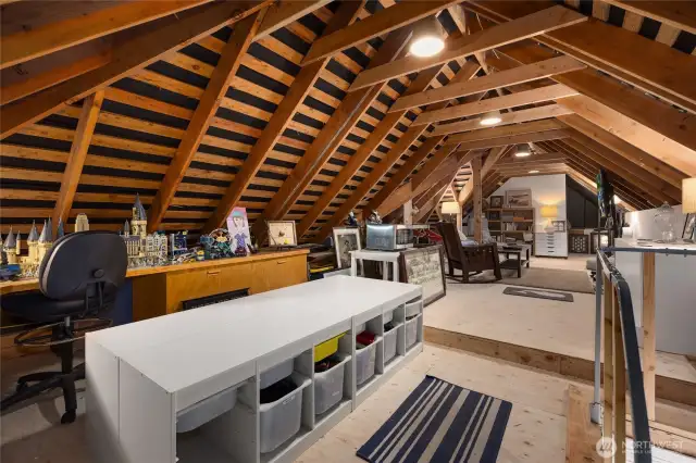 From the laundry area you can access this amazing attic space of approx. 800 sf which is partially finished with new insulation and electricity.  Currently the owners use this space as a cozy teenage hang-out space.
