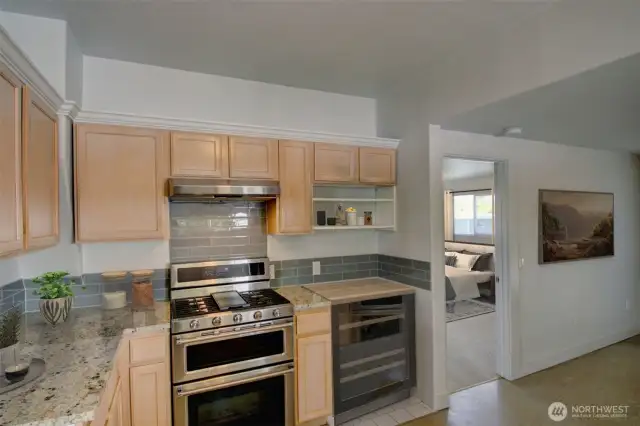 Virtually staged to show idea for adding a beverage fridge.