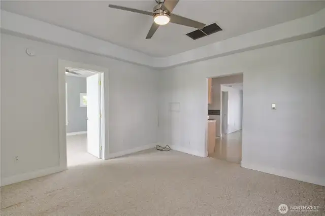Here's a different angle of the living room. The door on the left leads to one of the bedrooms, and the other takes you to the kitchen.