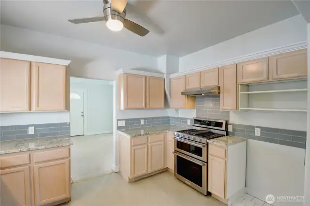 The gas stove with a double oven will delight the chef.