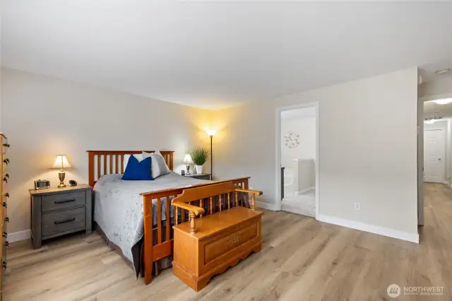 Large primary bedroom with attached 5 piece bathroom & walk-in closet