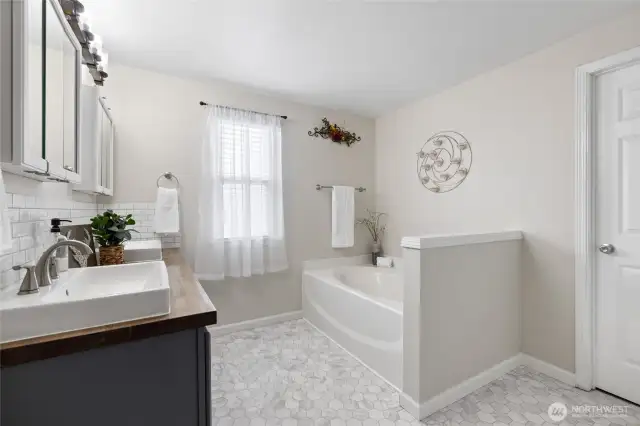 Attached primary bedroom 5 piece bathroom with large walk-in closet
