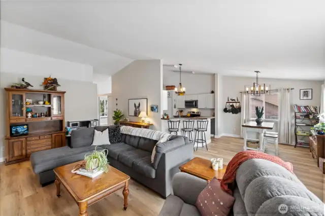 Open concept main living room with lots of natural light