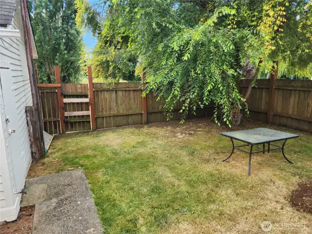 Fenced back yard, secure for pets