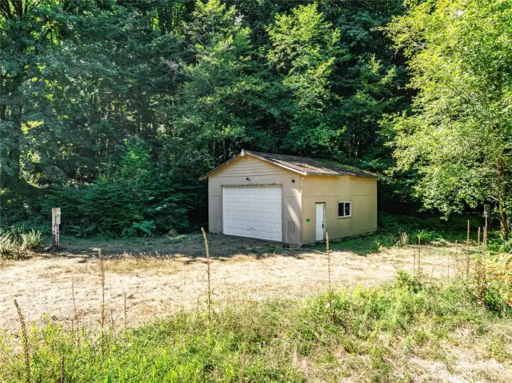 GARAGE AND UTILITY POLE IN LEFT OF FRAME.