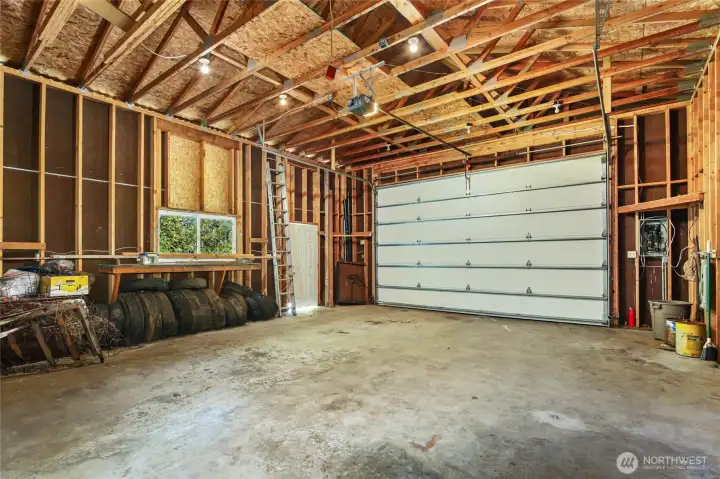 POWERED GARAGE DOOR & STORAGE SPACE FOR SUPPLIES.