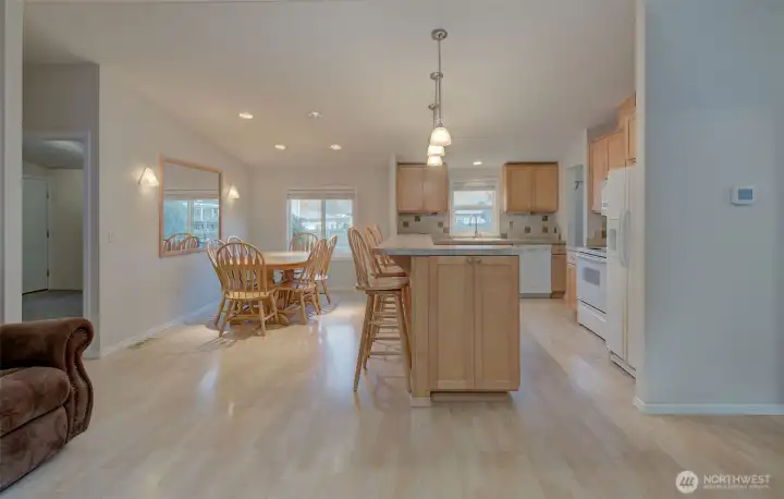 Dining room and kitchen with eating bar.