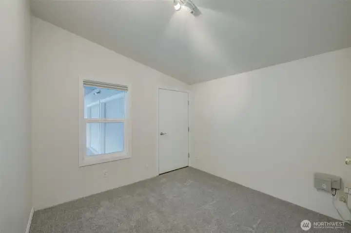 Bedroom #3 connects home to shop. That is the door to the shop.