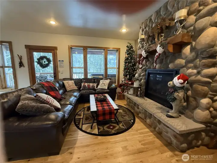 Plenty of windows to view out of when relaxing in the living room in front of the fire!