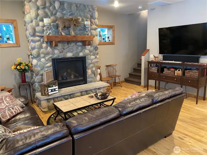 Warm inviting bedrock fireplace (gas) adds to the comfort and charm to get that full cabin feel.