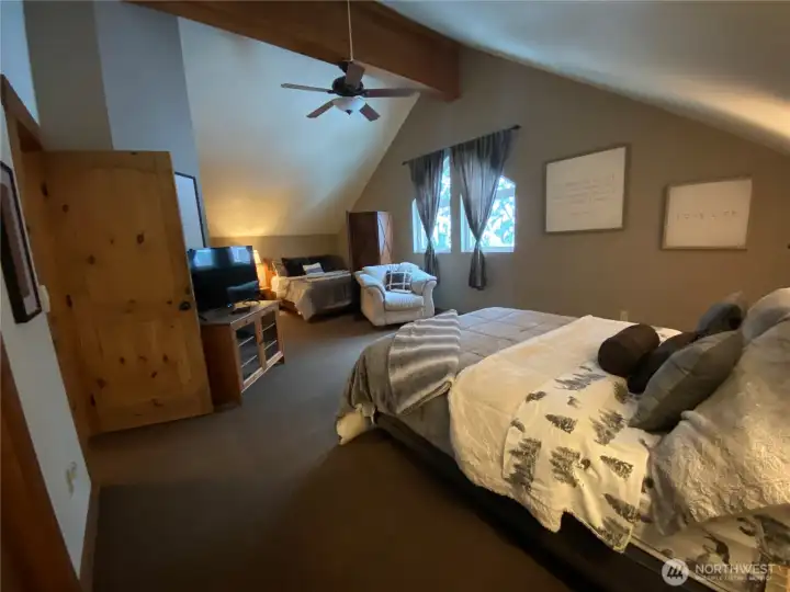 Master bedroom on upper level - two queen beds with divider.