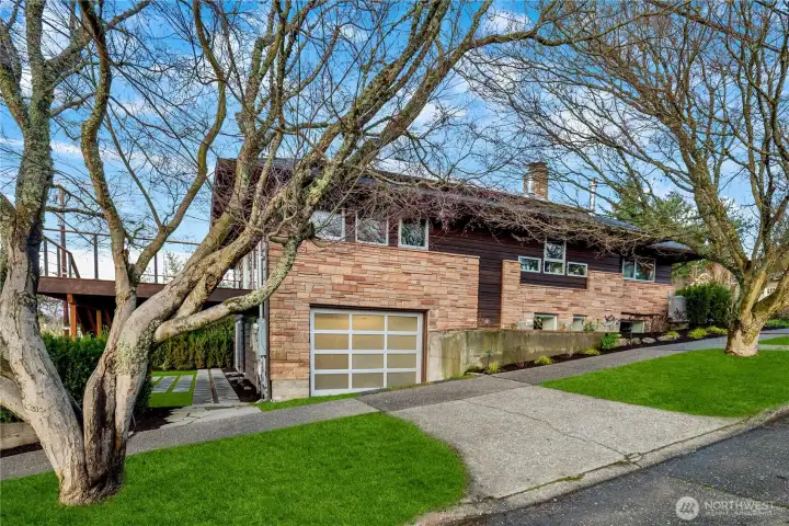 Convenient off-street parking and garage access seamlessly integrated into the home’s design.