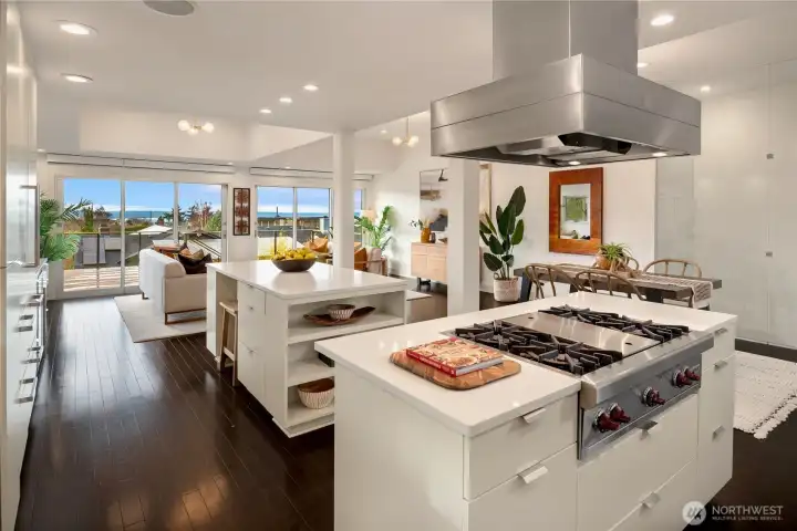 Walls of windows and deck access extend the living space outdoors, capturing natural light and serene views.