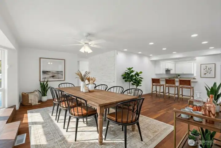 Fantastic sized dining room with additional lounge space directly off the kitchen. Propane fireplace lies on left hand side providing warmth and ambience. Kitchen lies to the rear, open to the dining and lounge space. Recessed lighting, beautiful newer flooring. Photo is virtually staged.