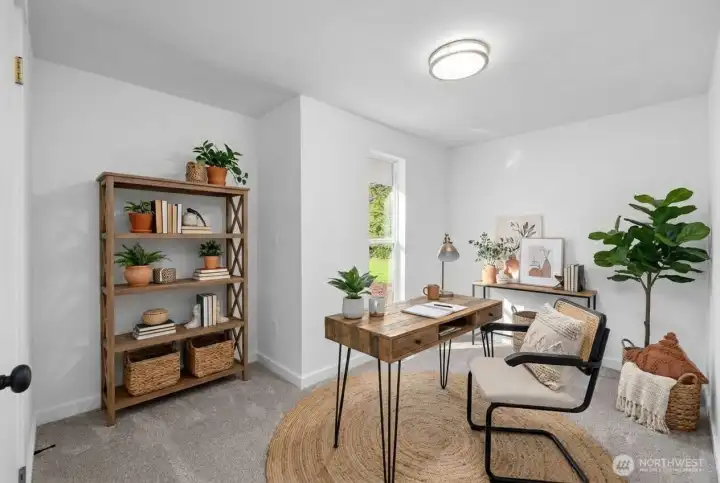 Another great sized 3rd bedroom virtually staged as an office. Floor to ceiling window has views of property and front walkway. Perfect for an office space or additional bedroom with great sized closet.