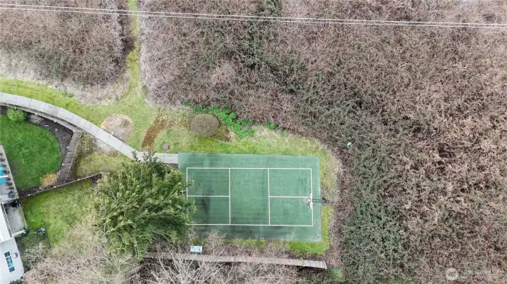 Looking down on the basketball court, or pickle ball court. Unit F104 is not far from the shared court.