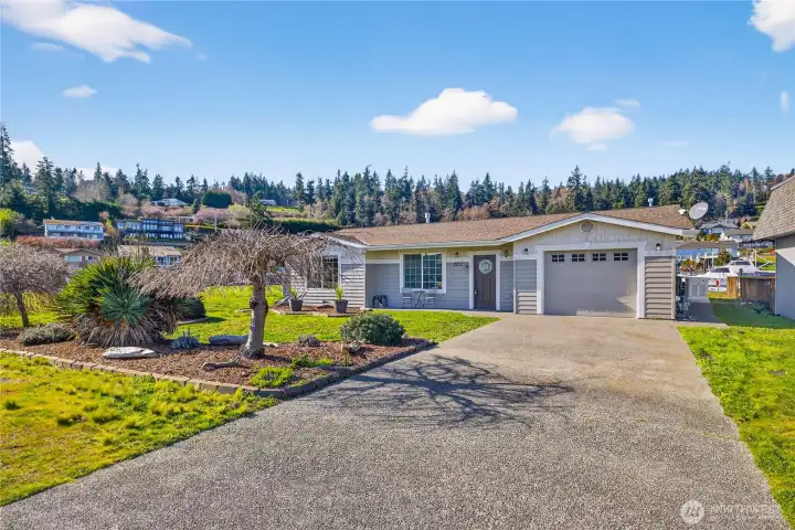 Enjoy the best of both worlds with this canal-front home featuring serene water views from the backyard and stunning mountain views from the front, all set in a peaceful, well-kept setting.
