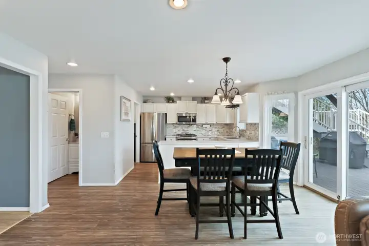 Looking in to the kitchen. Sliding door to the back deck and fenced yard.