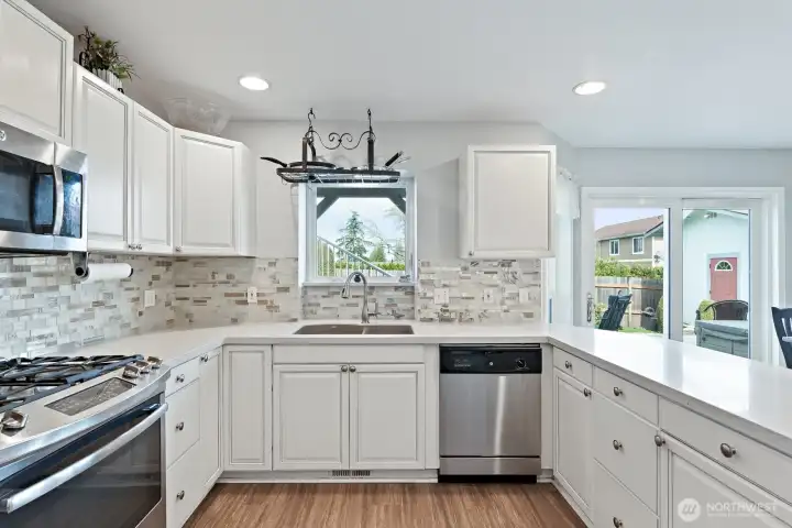 Nice sunny kitchen with eating bar.