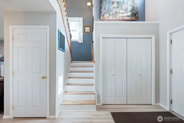 Grand entryway with soaring ceilings and beautiful staircase!
