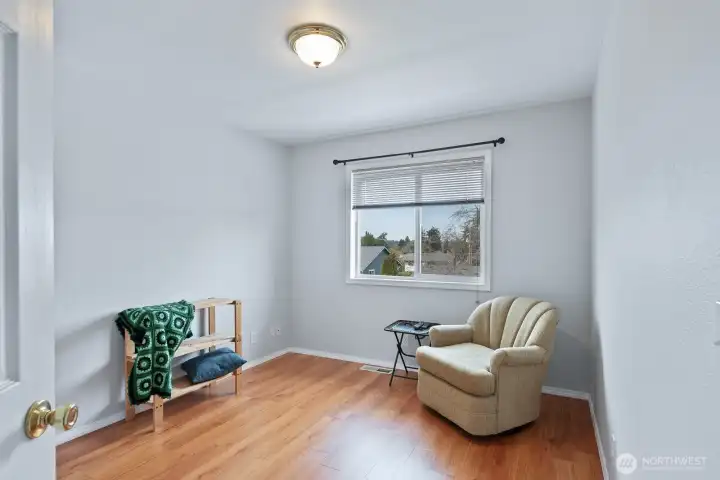 Another bedroom with vinyl plank flooring.