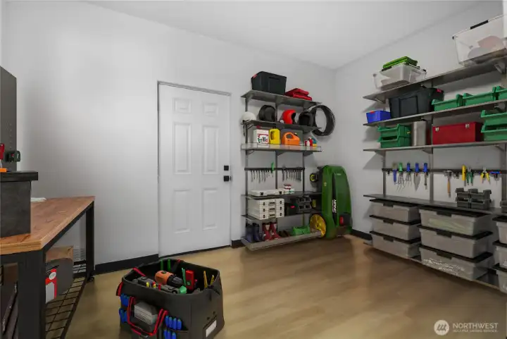 This is the workshop area off the garage.  Great area for hobbies, projects or storage.