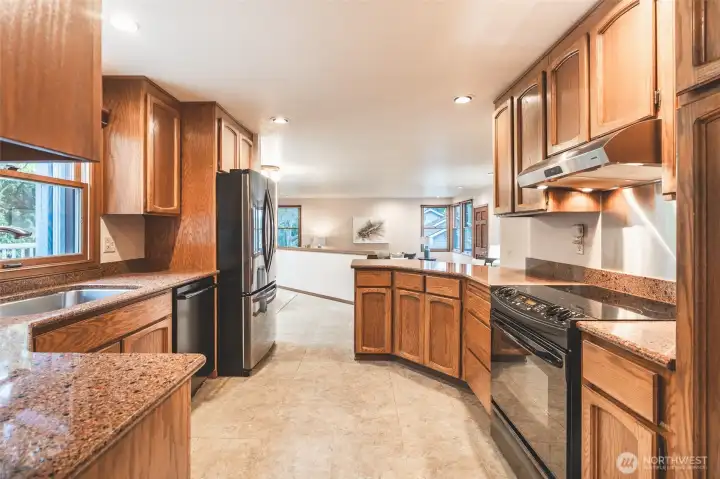 Beautiful Kitchen with updated appliances and Slab Granite Countertops