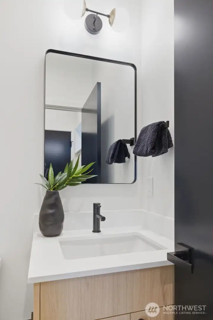 The powder room serves the main living level. There is also an adjacent large storage closet under the stairs for extra gear.