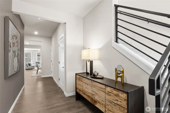 Hard surface flooring graces all entry areas and flows into living/dining and kitchen spaces.