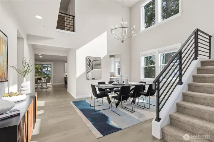 Dramatic 2 story formal dining room - photo from another community showing same plan.  Upgrades and finishes will vary.