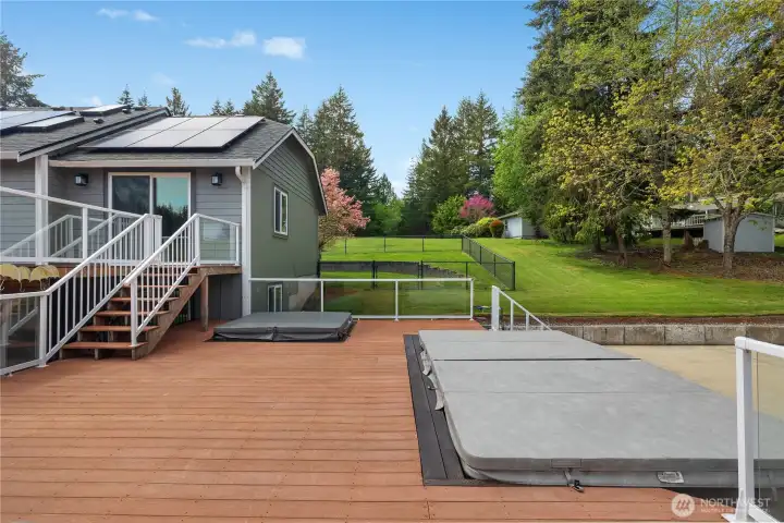 Lots of deck space with a swim spa and a hot tub