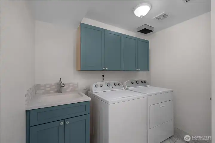 Laundry area with large utility sink and big closet storage area
